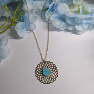 Collier doré et turquoise en forme de soleil